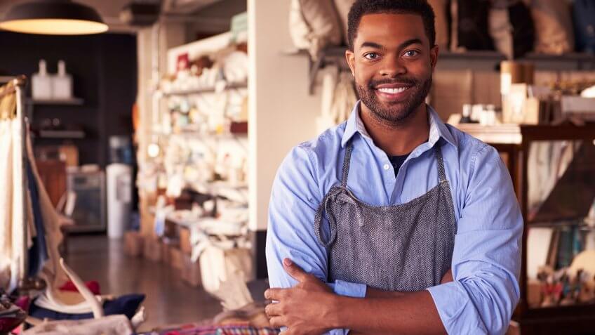 Cut taxes for small businesses. artist in apron in store