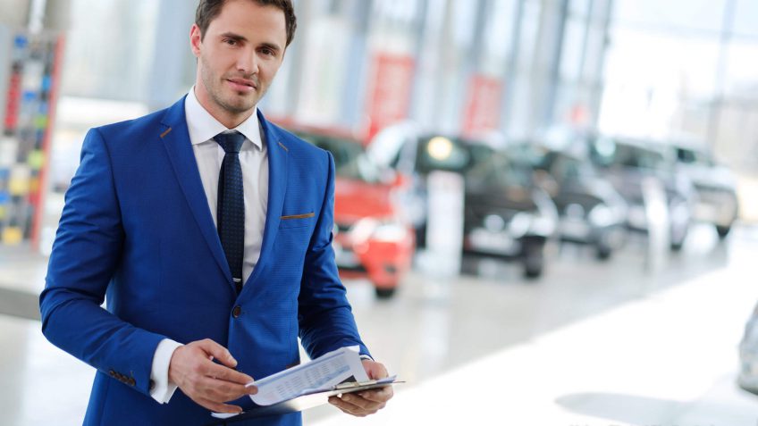 salesman in a blue suit carrying and invoice