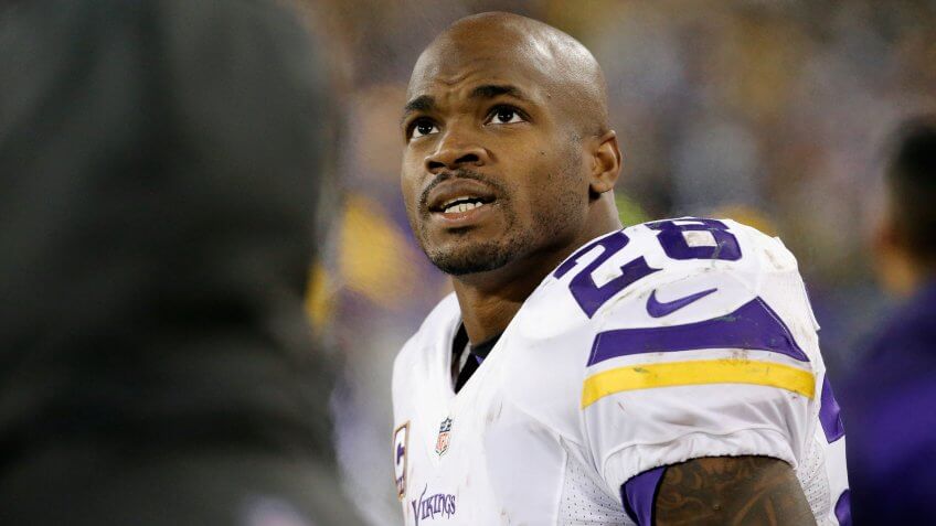 GREEN BAY, WI - JANUARY 03: Adrian Peterson #28 of the Minnesota Vikings looks on during the second half against the Green Bay Packers at Lambeau Field on January 3, 2016 in Green Bay, Wisconsin.
