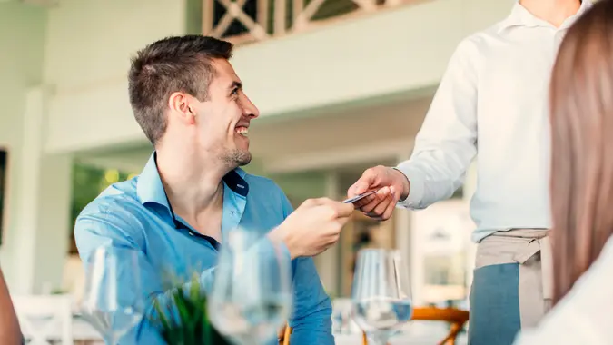 Group of friends enjoying lunch in restaurant together.