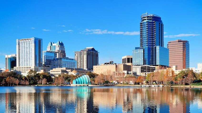 Orlando Lake Eola in the morning with urban skyscrapers and clea