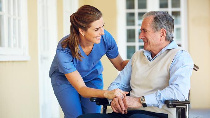Shot of a doctor caring for her senior patient at a nursing homehttp://195.