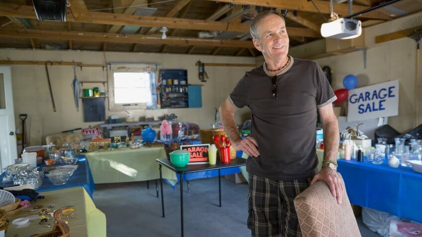 Confident man at garage sale.