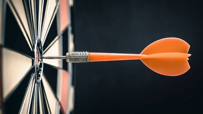 Darts in bull's-eye.