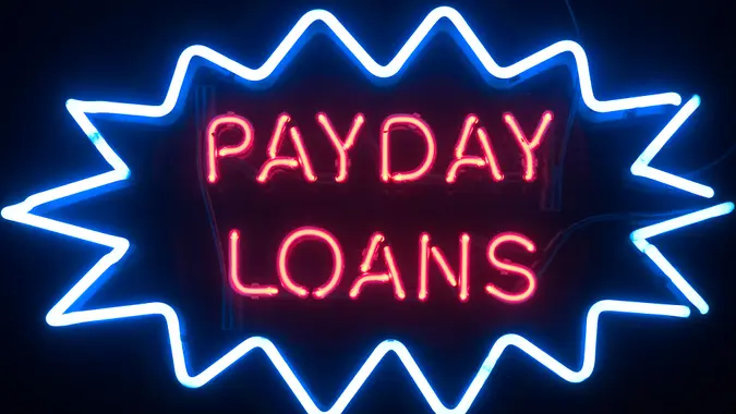 neon sign that says payday loans