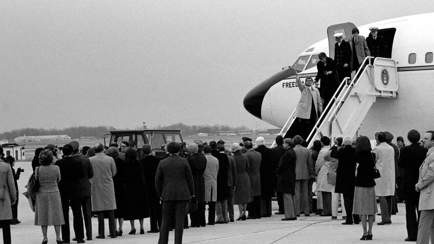 Recently freed Americans held hostage by Iran disembark Freedom One, an Air Force VC-137 Stratoliner aircraft, upon their arrival at the base.
