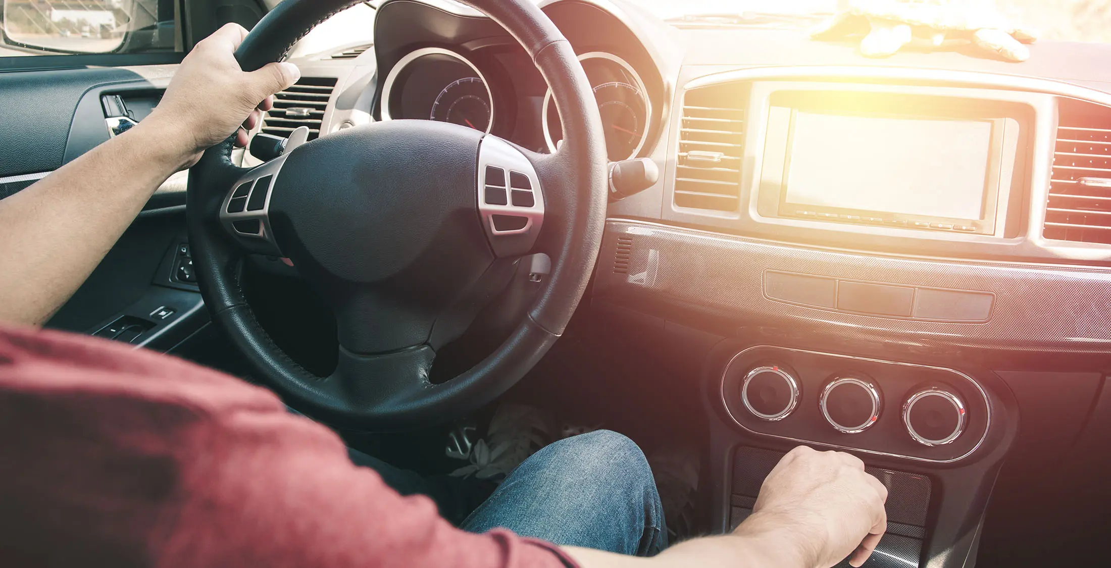 man in driver's seat of car