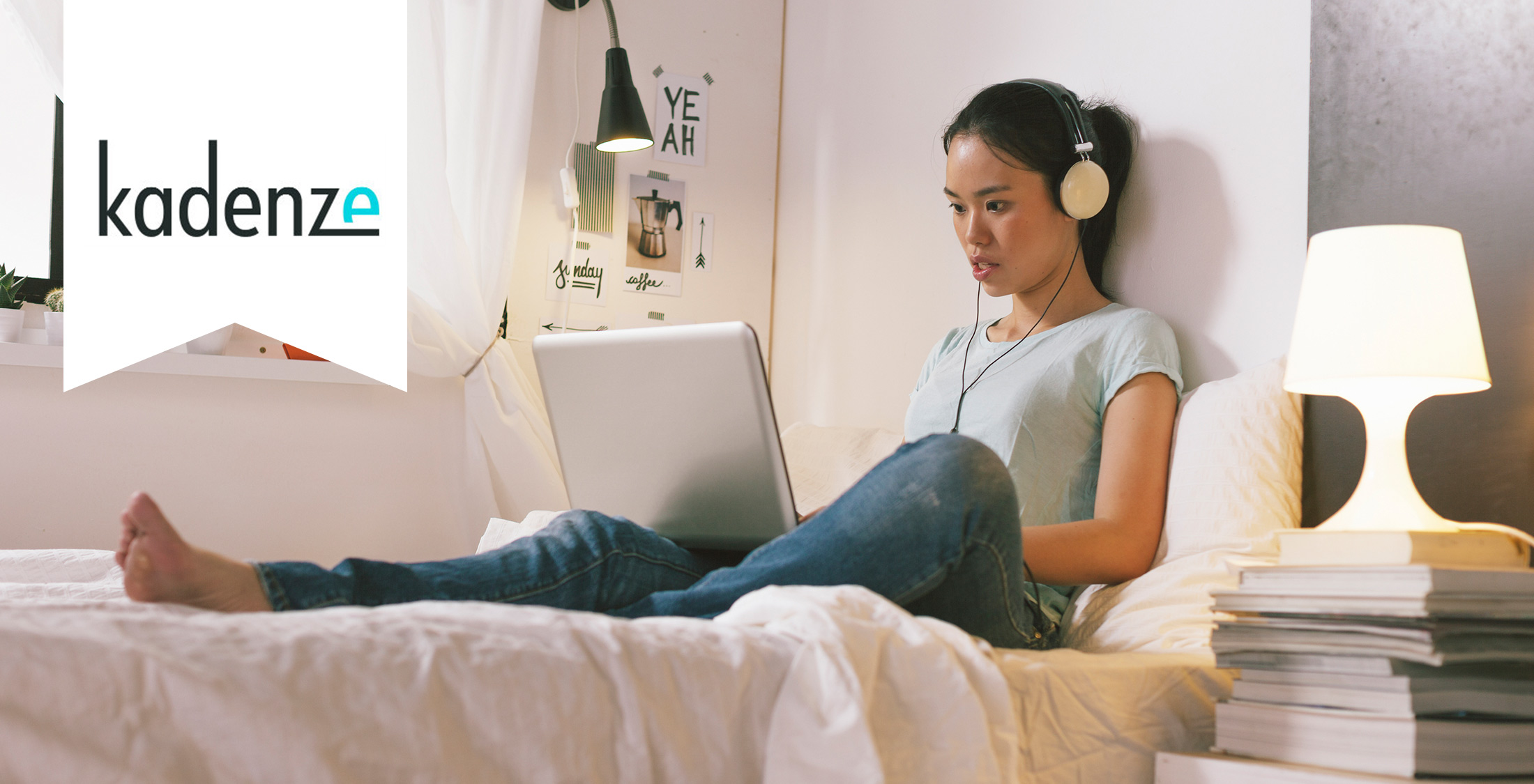 Kadenze. girl bed laptop headphones study