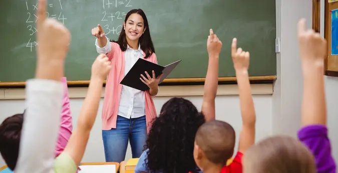 Elementary school teacher answering questions