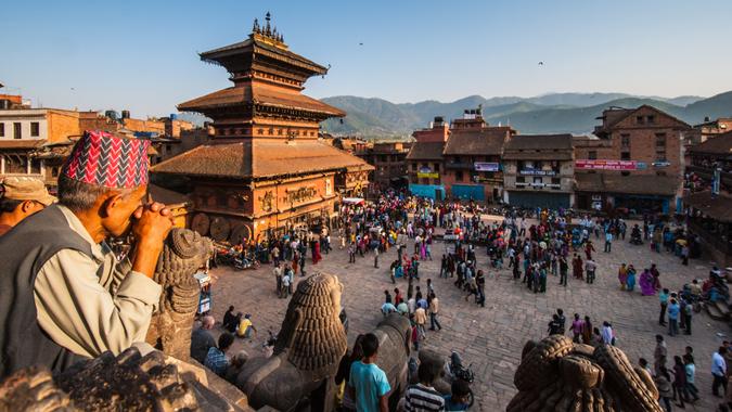 KATHMANDU, NEPAL-APRIL 14: Crowding of local Nepalese people visit the famous square of Bhaktapur on April 14, 2010 in Kathmandu, Nepal.