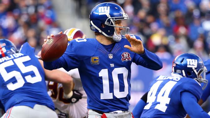 EAST RUTHERFORD, NJ - DECEMBER 14:   Eli Manning #10 of the New York Giants throws a pass in the first half against the Washington Redskins during their game at MetLife Stadium on December 14, 2014 in East Rutherford, New Jersey.