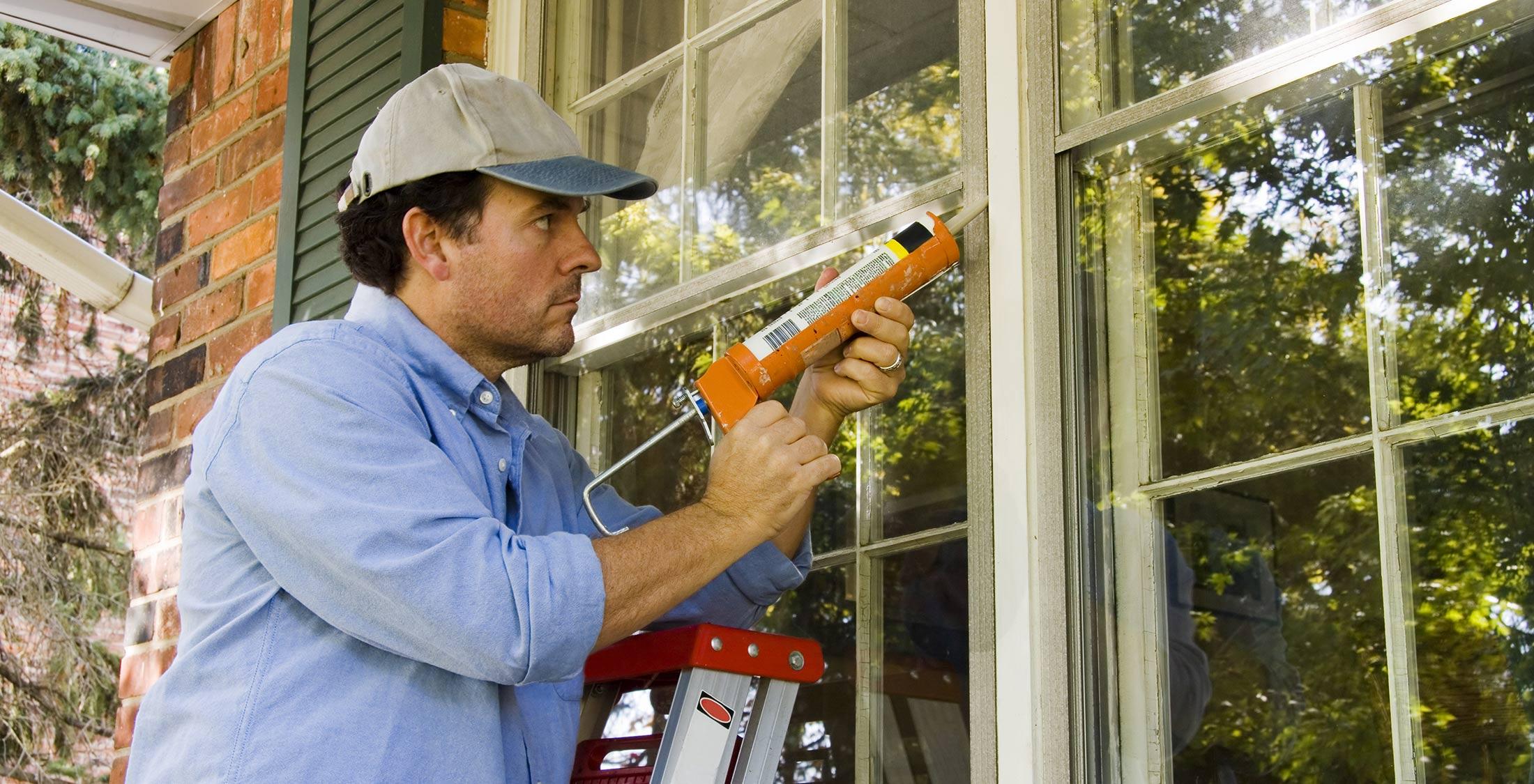 man fixing window