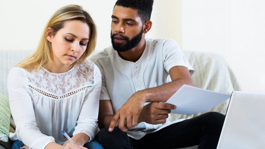 They don't want a joint account. couple looking over bank account statements