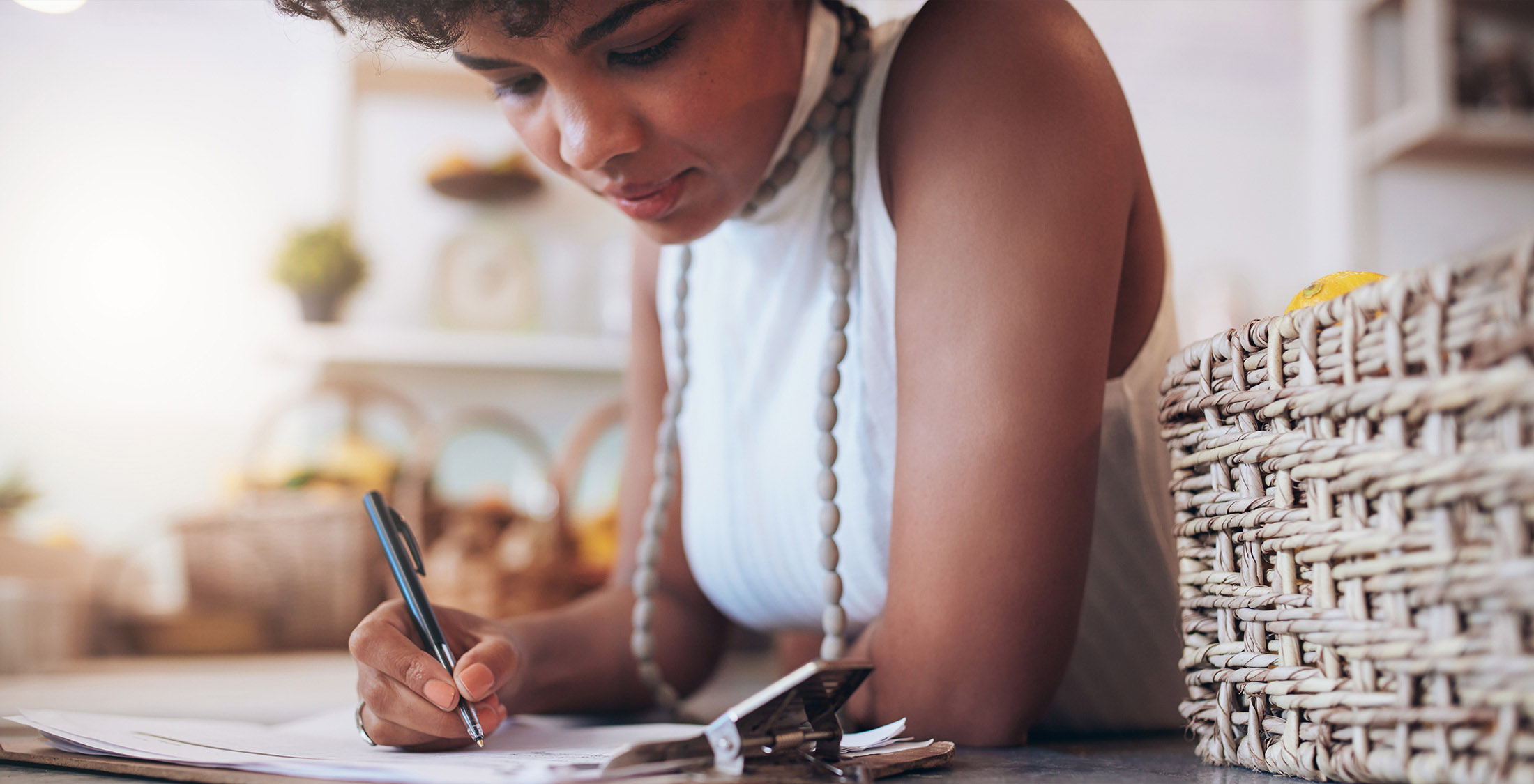 Showing positive cash flow. woman writing on clipboard