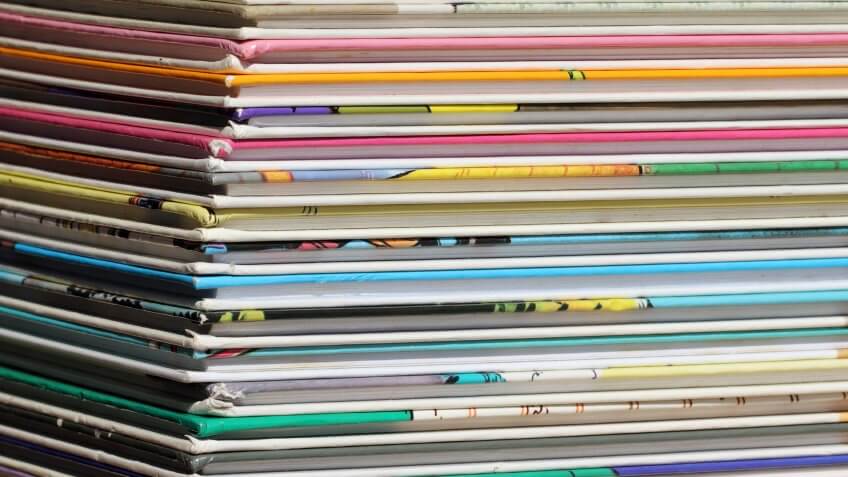 Buy trade paperbacks of comics. stack of picture books colorful