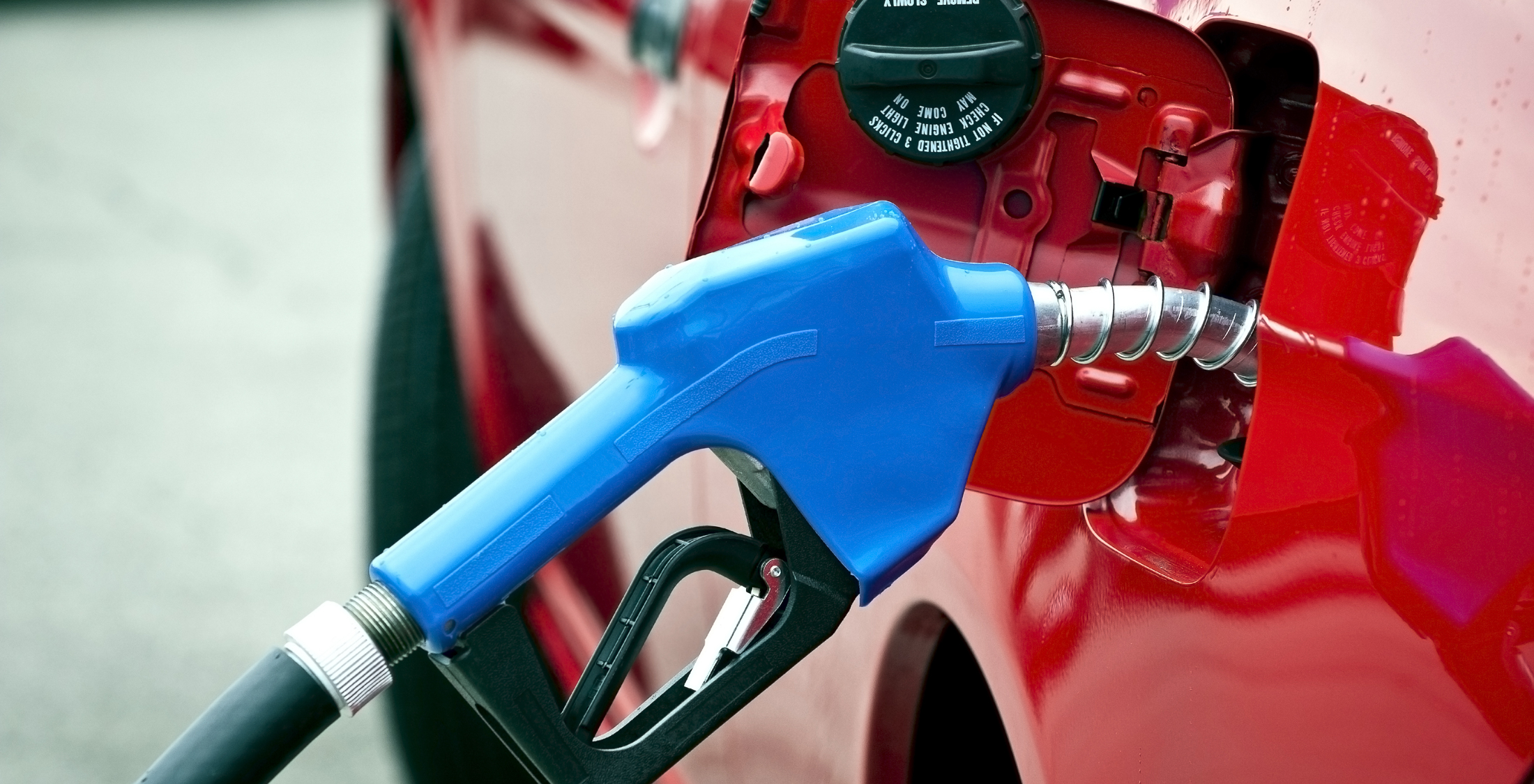 Trim recurring expenses, such as gas. gas pump filling up car