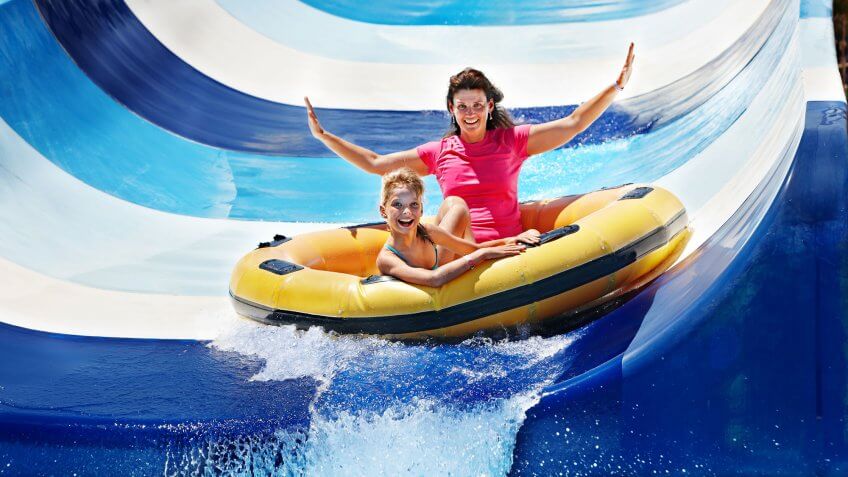 You're not organized and overspending. woman and girl in water park raft slide