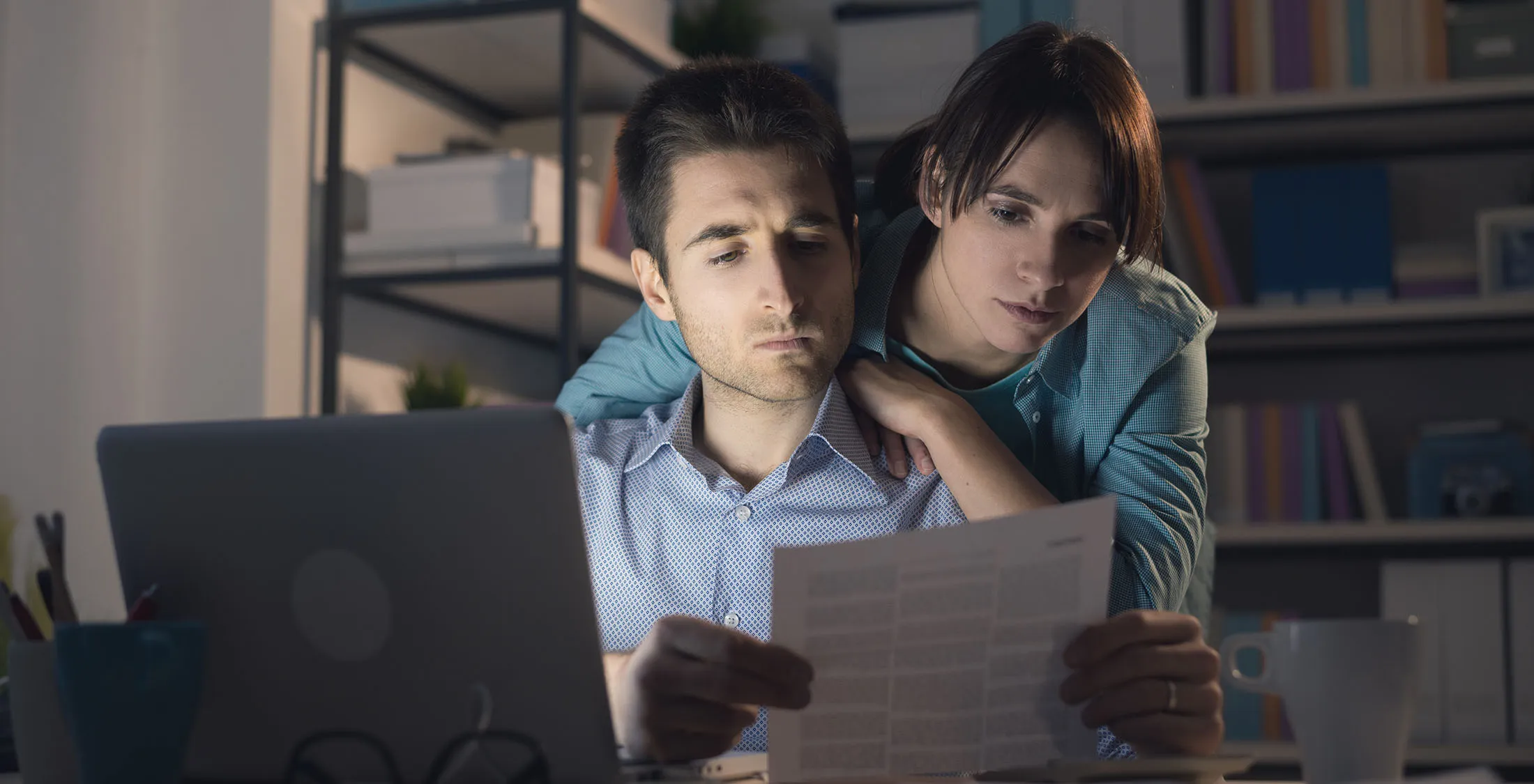stressed couple looking at credit score 