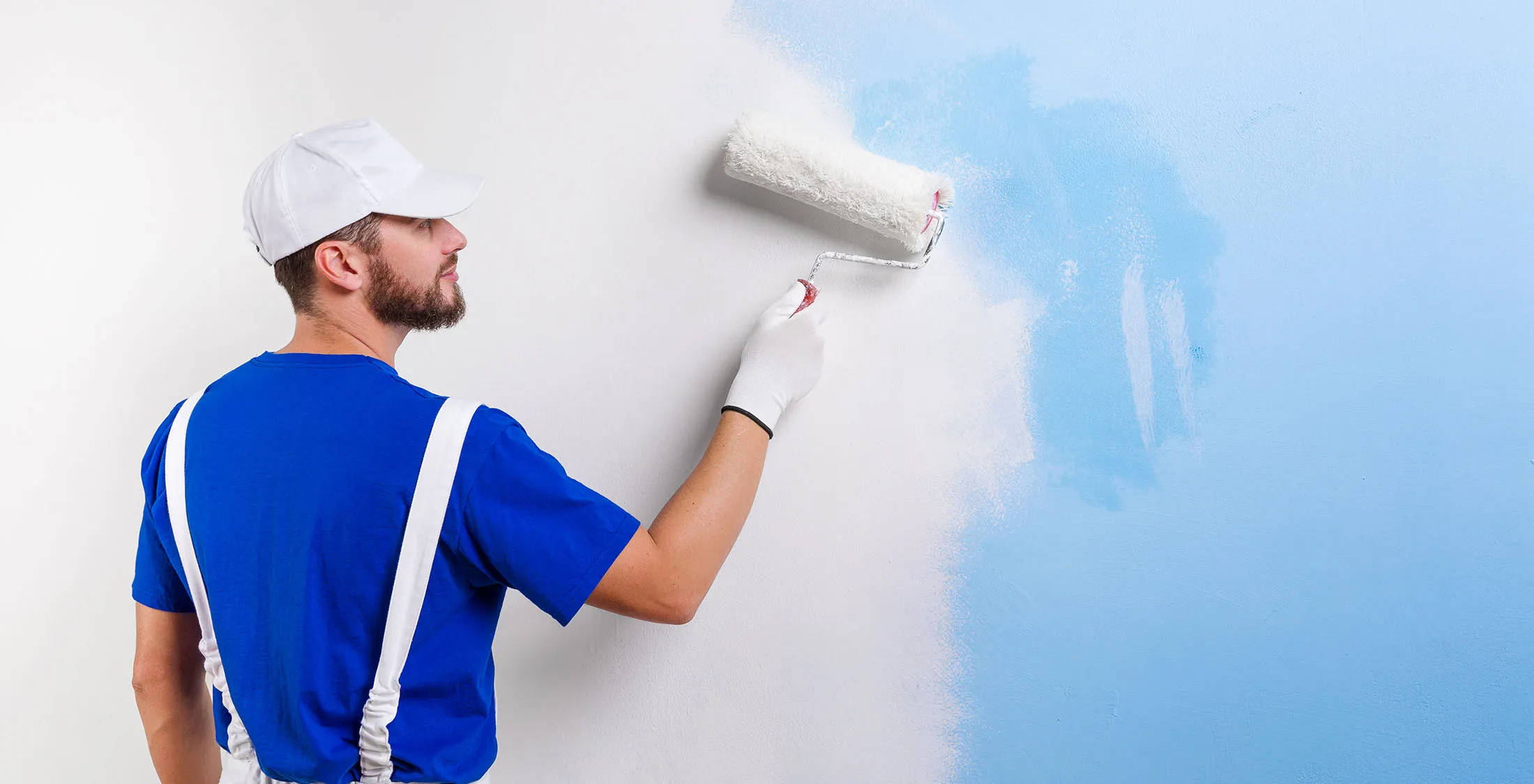 man painting wall