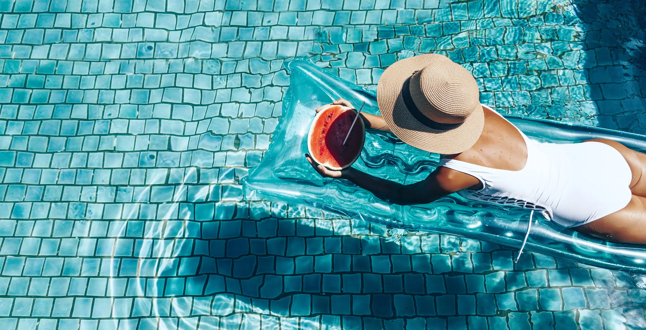 woman on raft in swimming pool