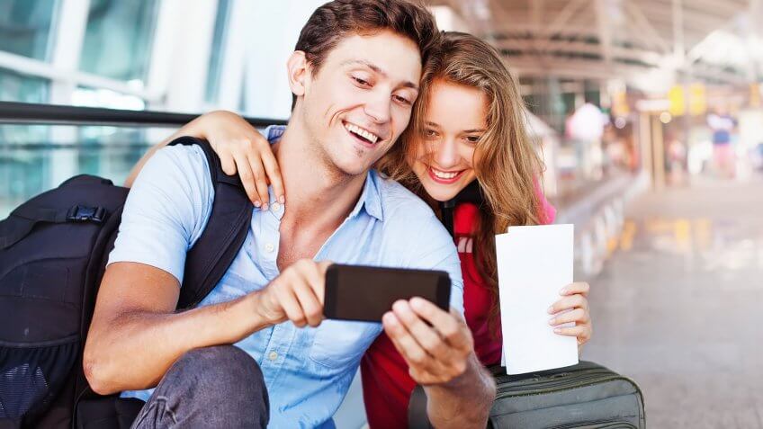 There are shorter security lines, less aggravation. couple taking selfie