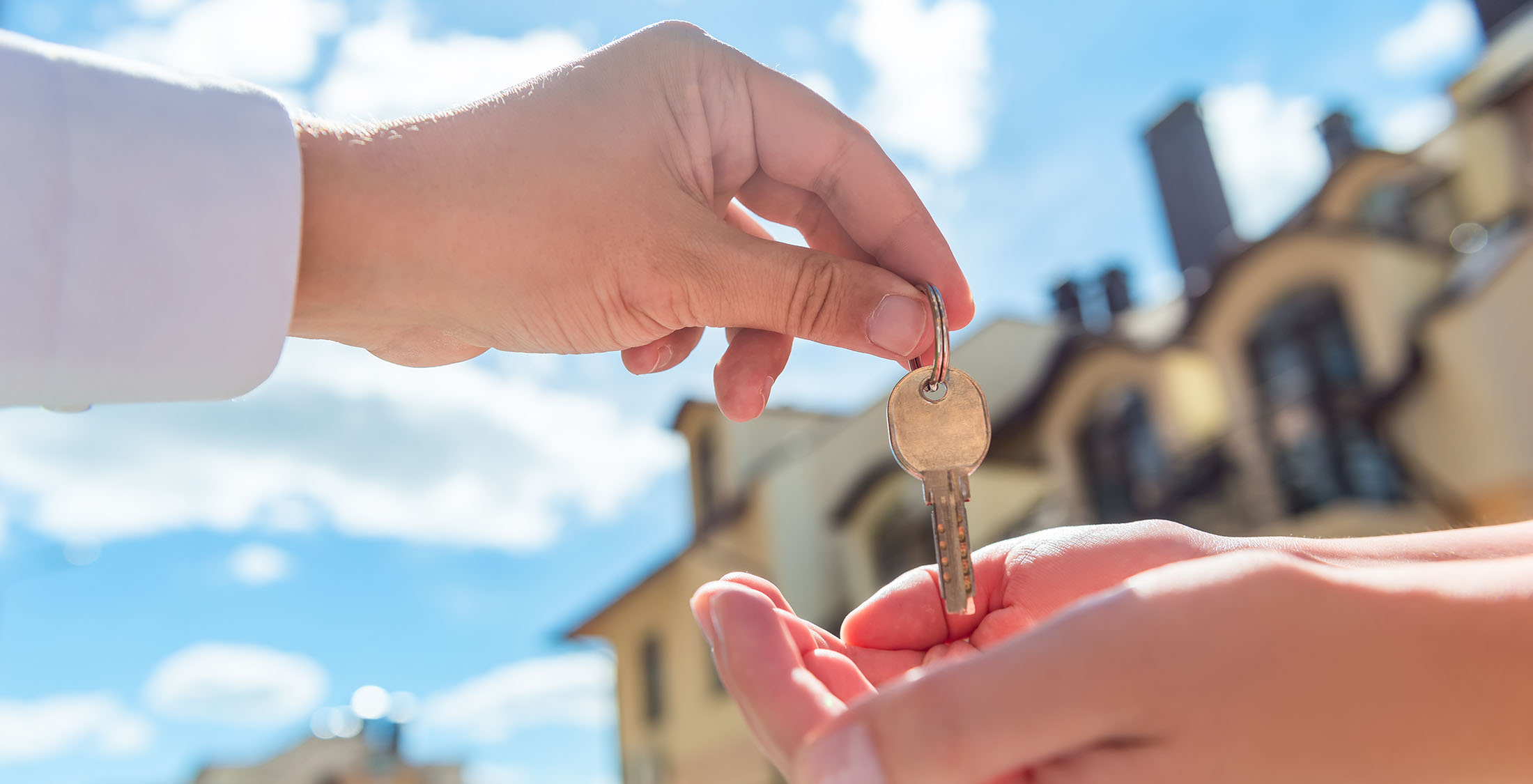 Some landlords and employers will run a credit check. handing off keys in front of house