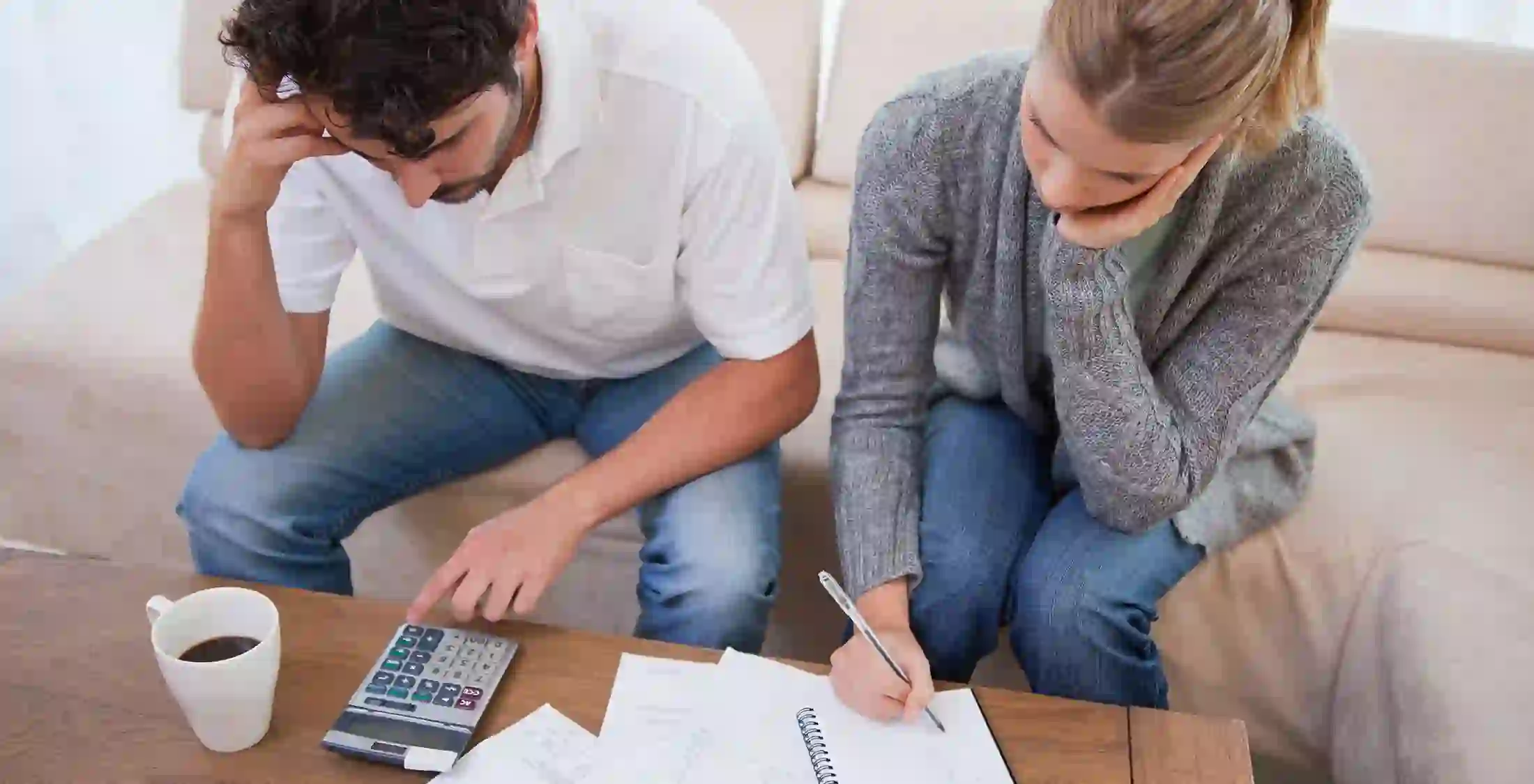 stressed couple trying to budget