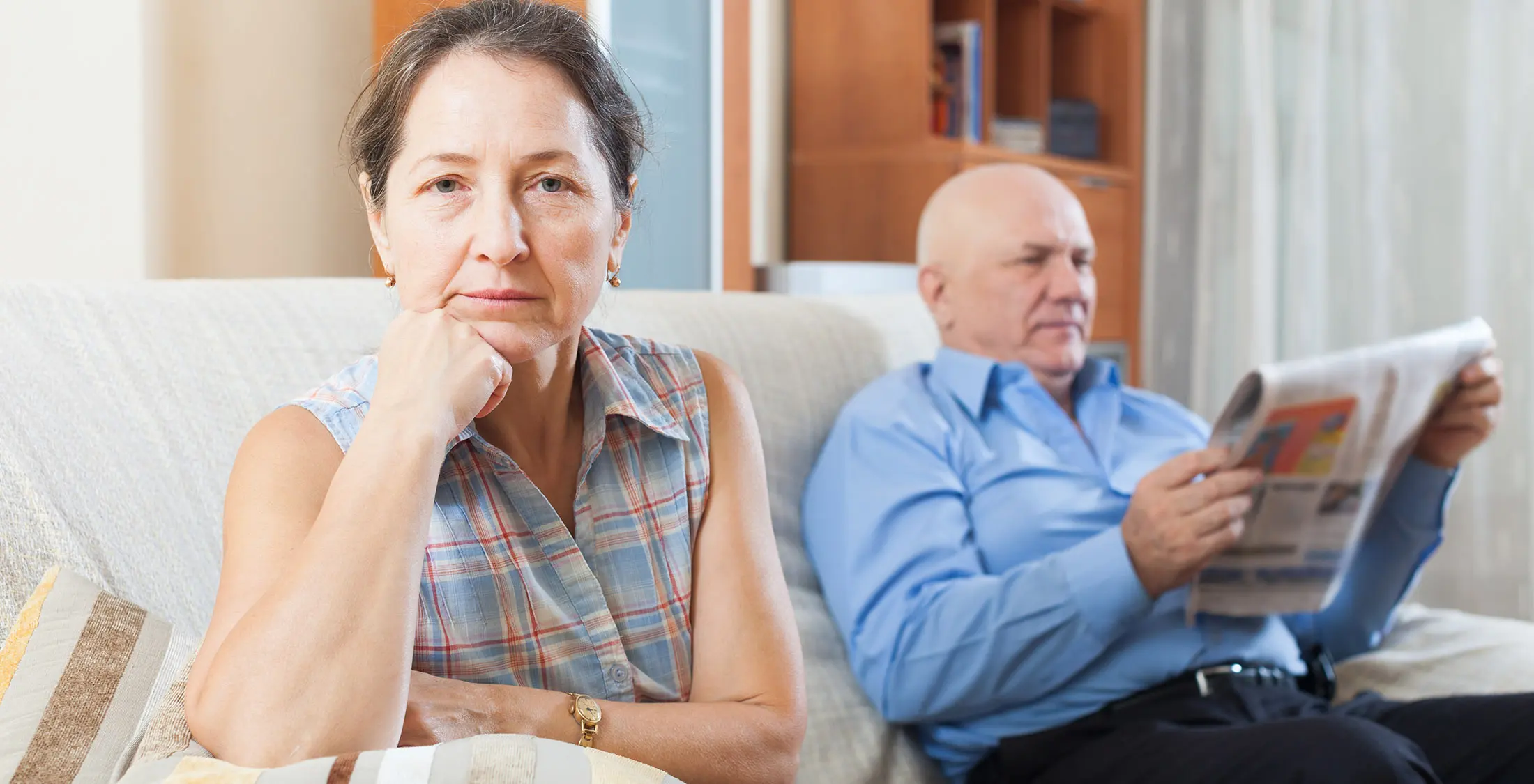 elder woman and man on couch