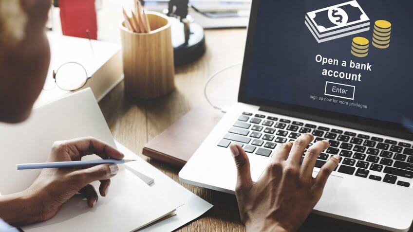 Your passwords to your bank accounts keep changing. person opening a bank account on their computer