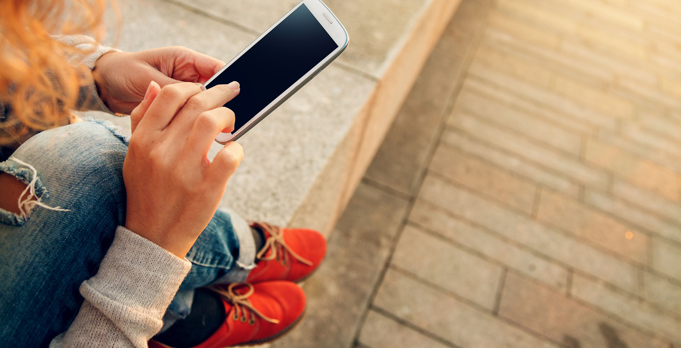 Lower your cell phone bill. person using their cell phone