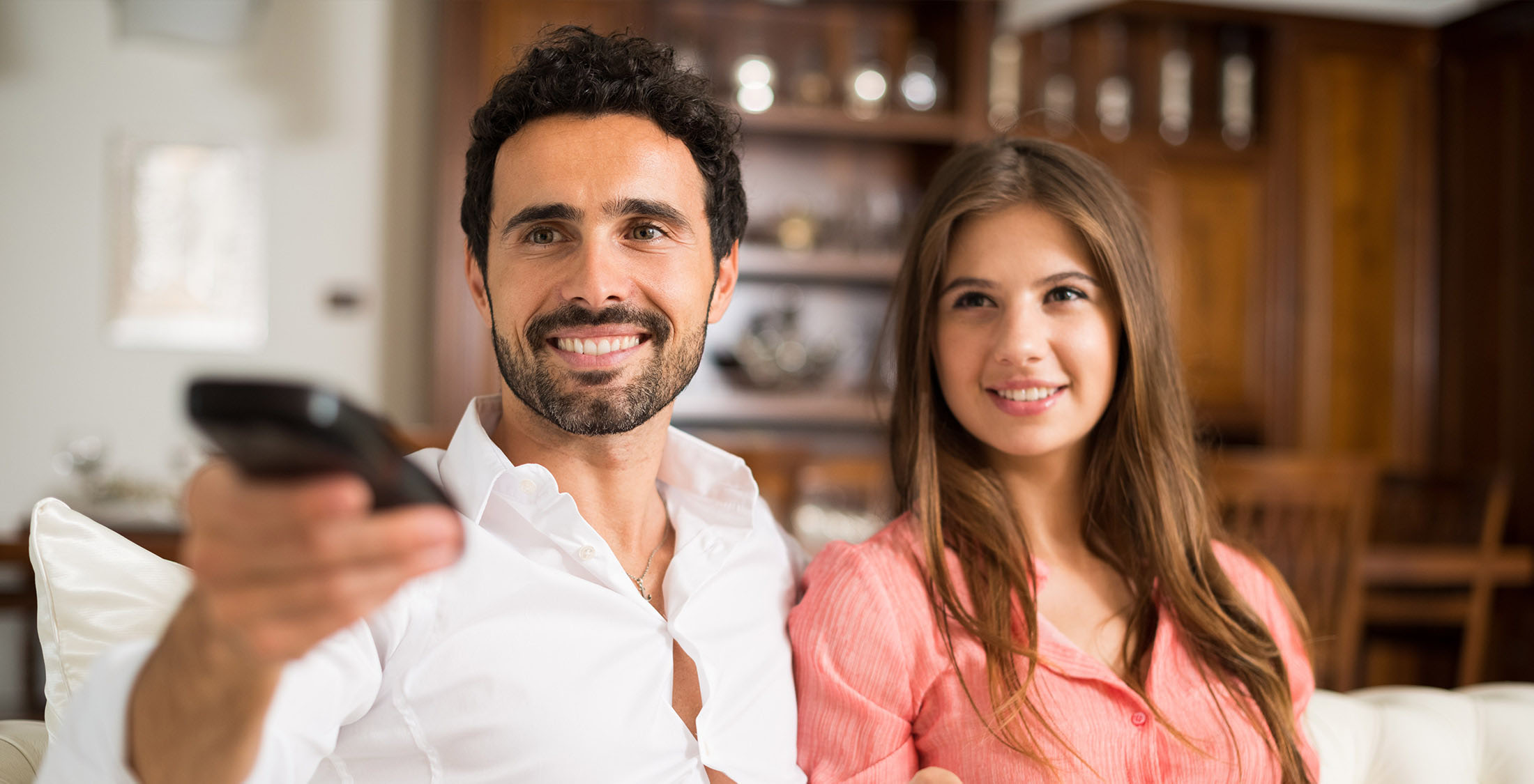 Cut your cable subscription. couple watching tv