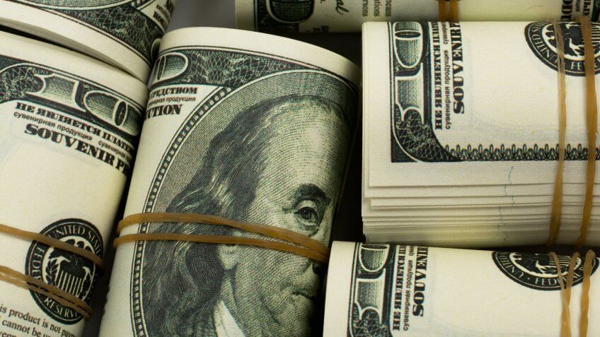 You find stashes of cash in the home. rolled up rubberbanded one hundred dollar bills