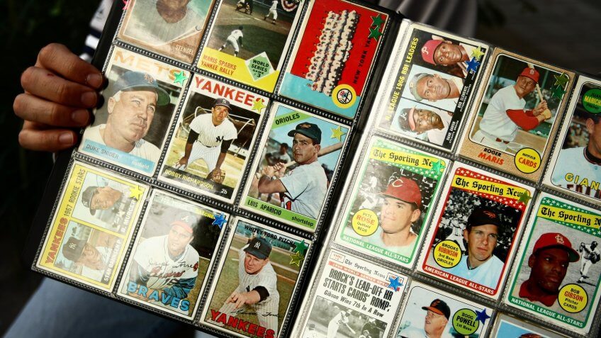 NEW YORK - SEPTEMBER 21: A man sells vintage baseball cards prior to the start of the last game at Yankee Stadium between the Baltimore Orioles and the New York Yankees on September 21, 2008 at Yankee Stadium in the Bronx borough of New York City.