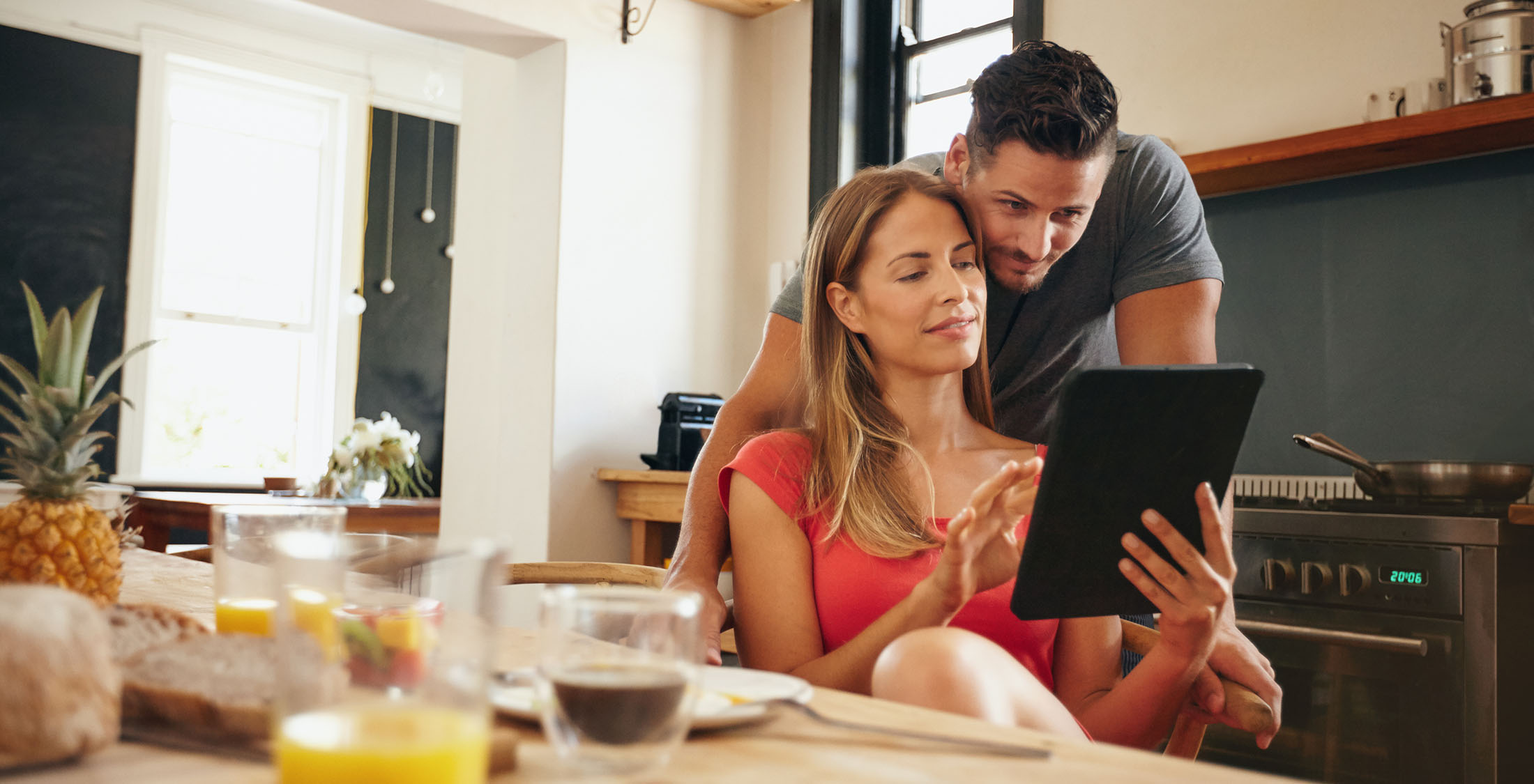 Less pressure to keep up with the Joneses. couple looking at tablet together
