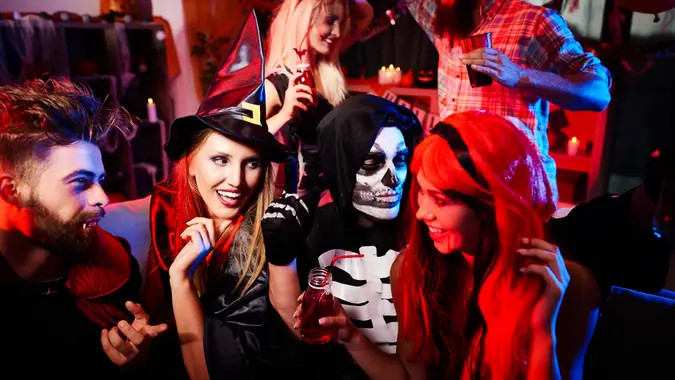 Friends in costumes at the party.