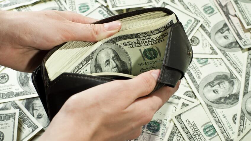 John Stumpf will not get a severance package. hundred dollar bills in wallet and on table