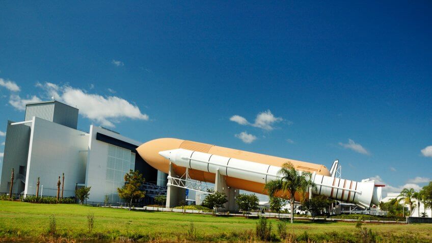 NASA Space Shuttle Solid Rocket Boosters and External Fuel Tank on display.