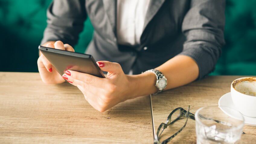 woman on phone in coffee shop