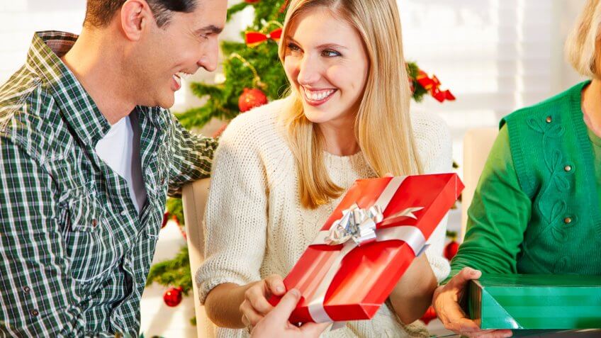 People giving gifts to each other People giving gifts to each other