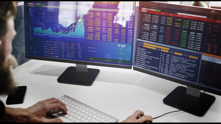 Retirement savers need stocks in their portfolios, according to Suze Orman. man looking at stock market analytics