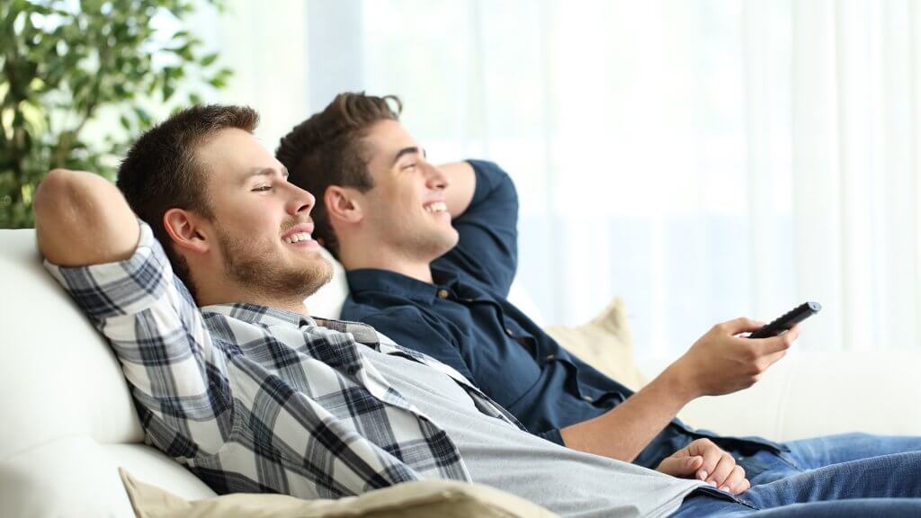 Get some roommates. roommates watching tv together