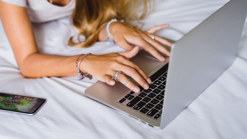 Do your research. woman typing on laptop