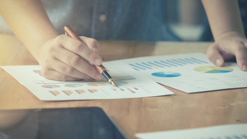 Rebalance your portfolio. person working with charts
