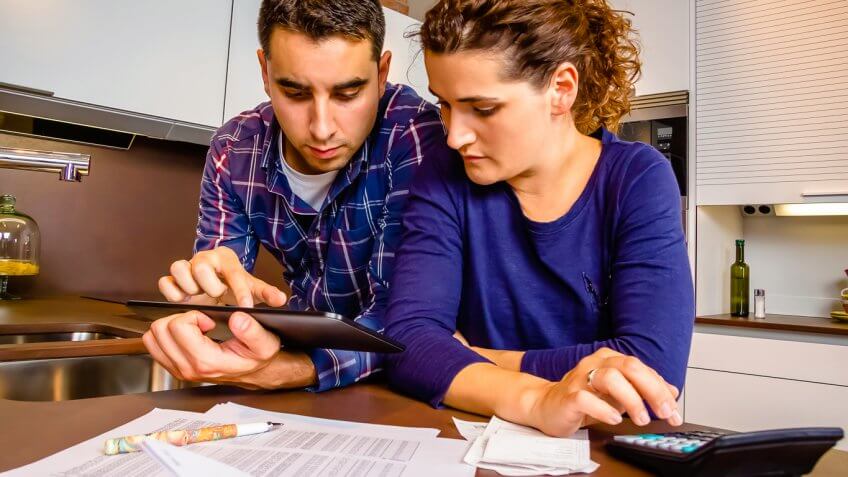 Couple calculating finances Couple calculating finances