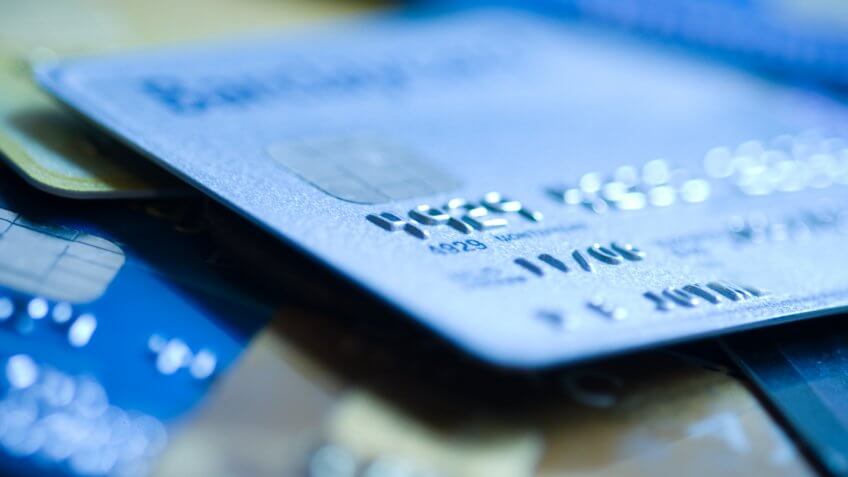 "Pile of credit cards, narrow focus.