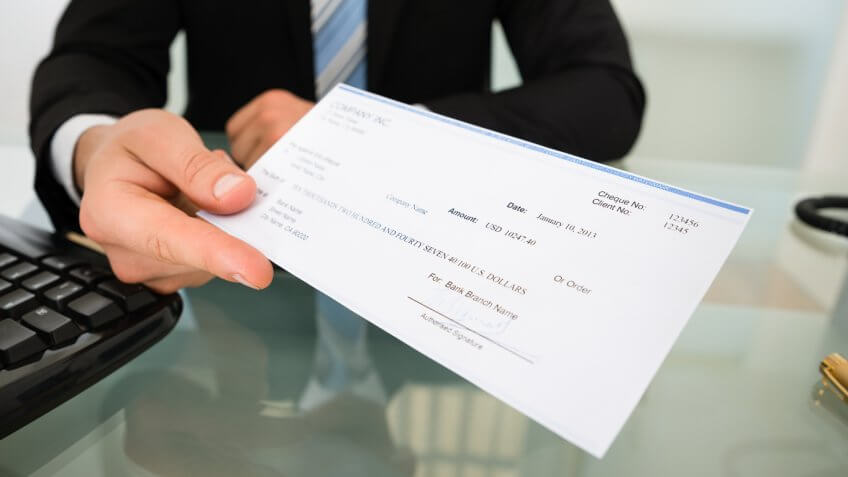 Man handing over check Man handing over check