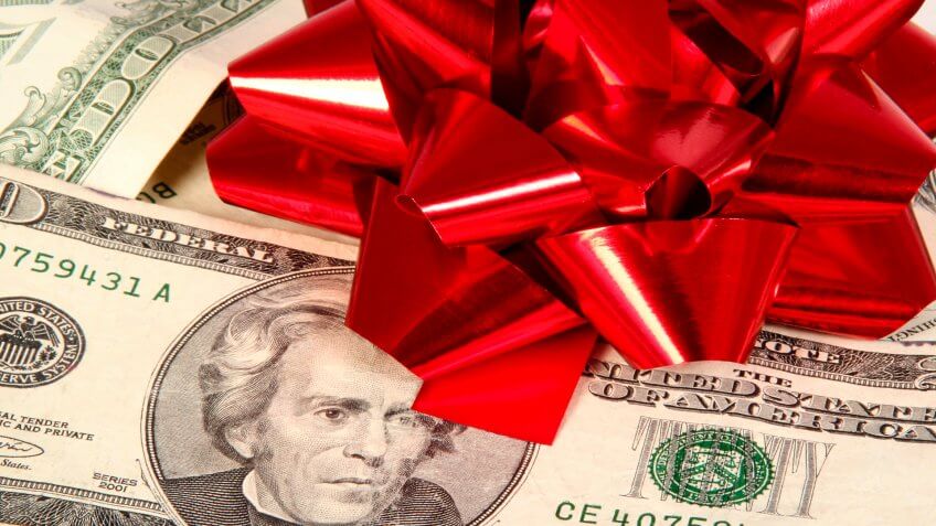Christmas bow on money.