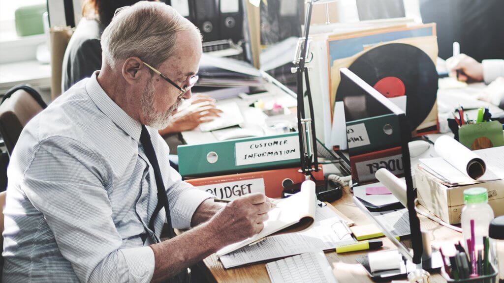 You may need to get another job. older man at desk reviewing budget information