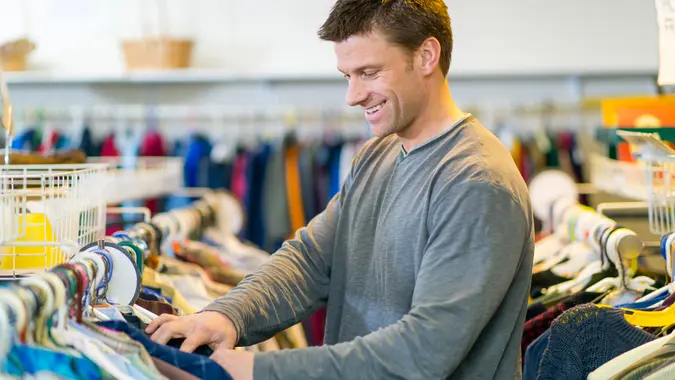 Shopping for clothes at a thrift store.