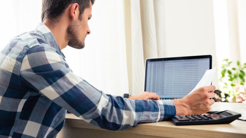 Man reviewing finances Man reviewing finances